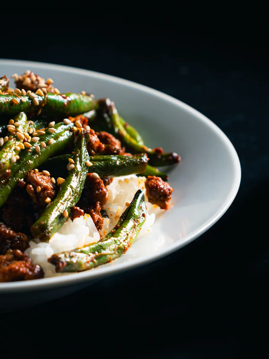 Close-up of a plated dish on a dark background, Aki food photography